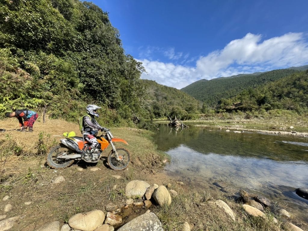Who should be engaging on an adventure motorbike tour from Vietnam to Laos?